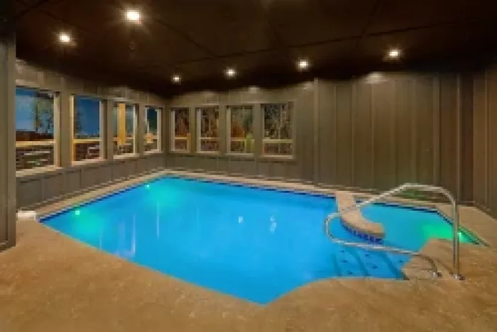 private pool cabin getaway in gatlinburg,private pool cabin vacation,romantic cabin with private pool,group cabin with private pool,indoor vs outdoor private pool cabin in smoky mountains,year-round pool cabin gatlinburg,private pool cabin trip