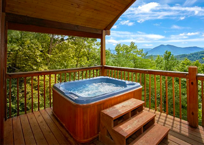 Cabin's Deck with a Hot Tub and Mountain View